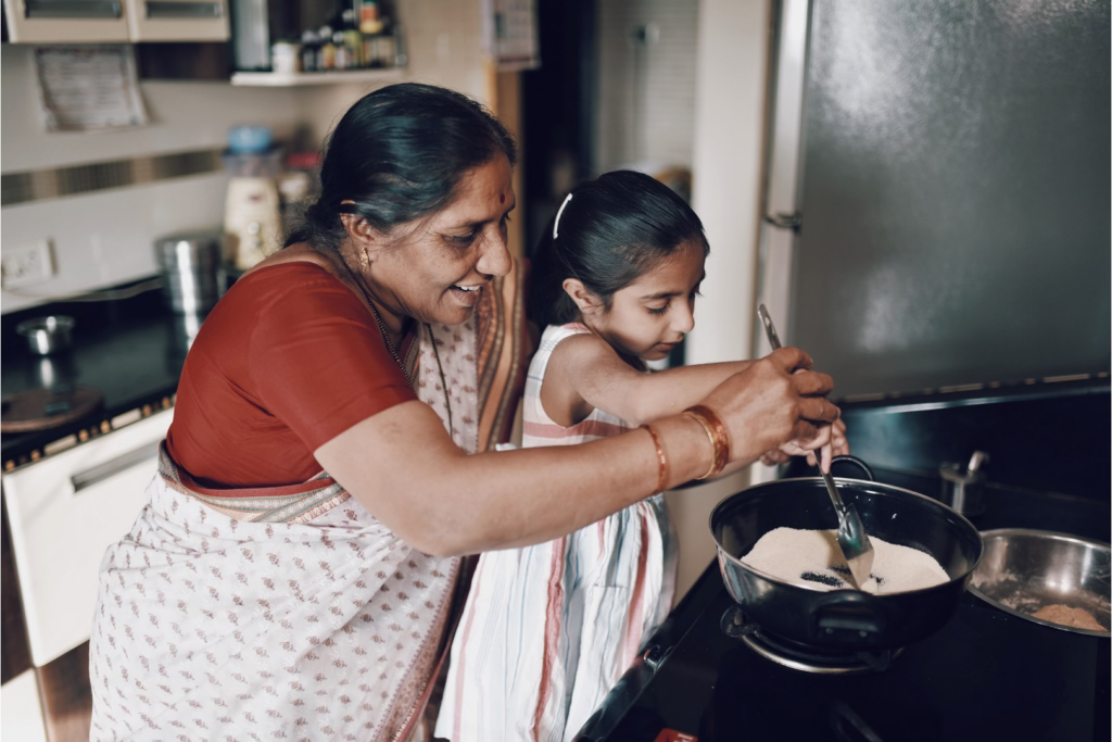 a mother and daughter cooking together