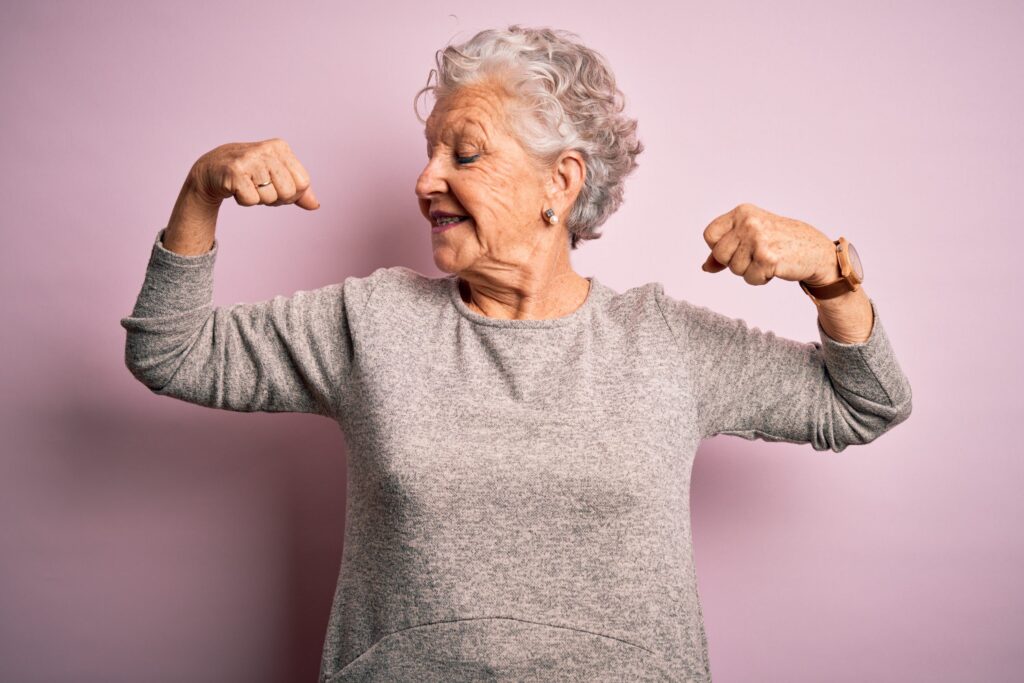 a woman flexing her muscles