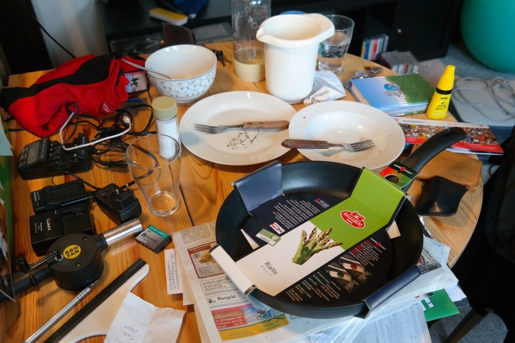 a dirty and cluttered kitchen table