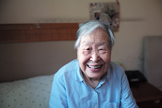 an elderly person smiling